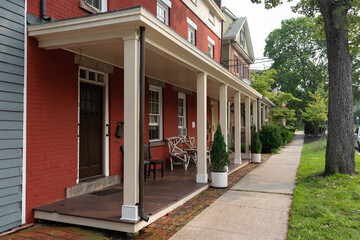 Row of Old and Colorful Buildings and Homes along an Empty Sidewalk in Cold Spring New York