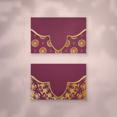 Burgundy business card with luxurious gold pattern for your business.