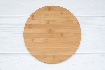 Blank round wood sign with copy space lies on white background. Simple Mockup farmhouse circle sign.
