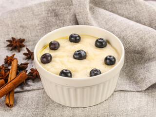 Tasty dairy porrige with berries