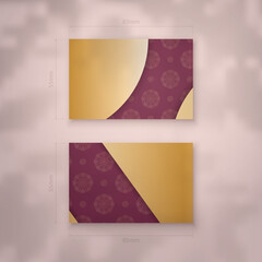 Burgundy business card with vintage gold ornaments for your personality.
