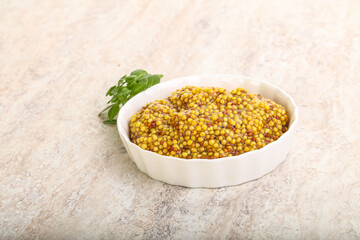 Grain mustard sauce in the bowl