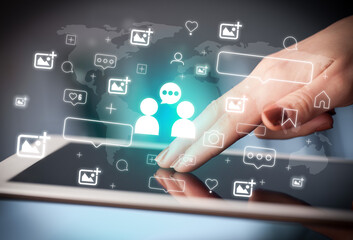 Close-up of a hand using tablet, social media concept