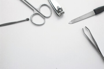 border frame from manicure tools on white. High quality photo