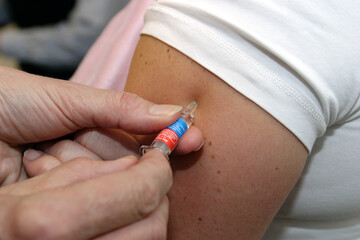 A person getting an inluenza injection