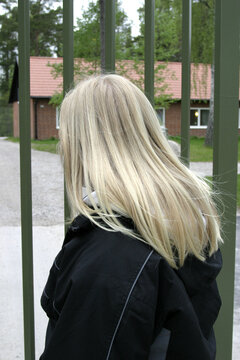 a woman with blonde hair back view.