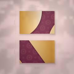 Business card in burgundy color with abstract gold pattern for your brand.