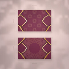 Business card in burgundy color with greek gold ornaments for your brand.