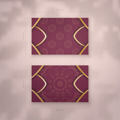 Business card template burgundy with abstract gold ornaments for your personality.