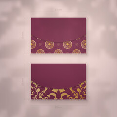 Business card template burgundy with Indian gold pattern for your brand.