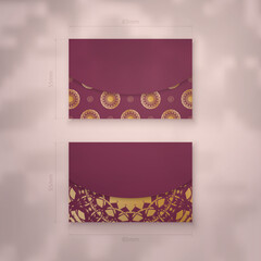 Business card template burgundy with vintage gold ornaments for your brand.