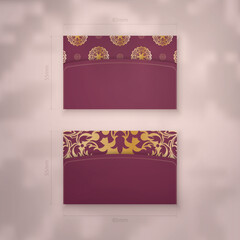 Business card template burgundy with vintage gold ornaments for your business.