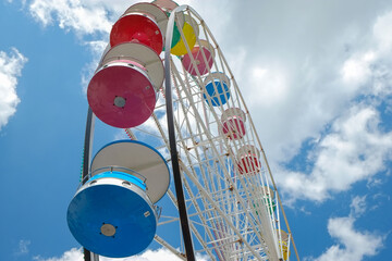 Colorful old-fashioned ferris wheel on a summer day
