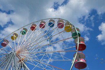 Colorful old-fashioned ferris wheel on a summer day