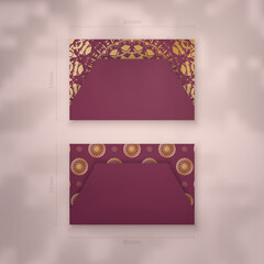 Business card template burgundy with vintage gold pattern for your contacts.