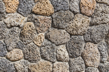 Old brick wall of rough stone