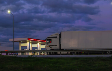 Fototapeta na wymiar Truck moves on country highway