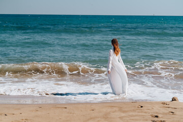 Fototapeta na wymiar woman silhouette sandy beach waves ocean nature Lifestyle