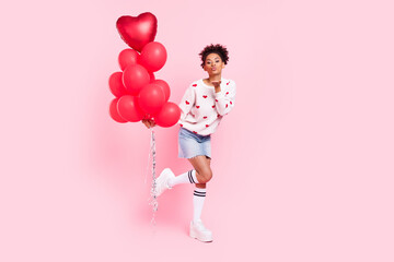 Full size photo of youth african lady send air kiss coquettish many helium balls isolated over pink color background