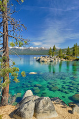 The beautiful clear waters and granite boulders of Lake Tahoe on the Nevada and California border - 470318679