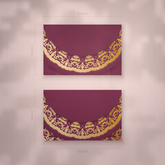 Business card template in burgundy color with luxurious gold ornaments for your brand.