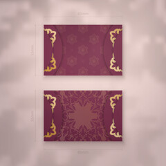 Business card template in burgundy color with vintage gold ornaments for your business.