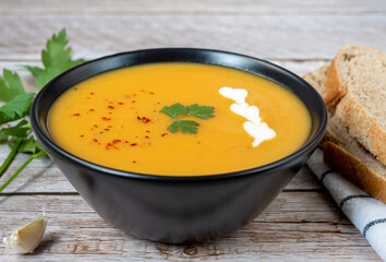 Vegan pumpkin and pepper puree soup in a bowl.