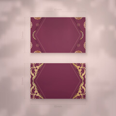 Business card template in burgundy color with vintage gold pattern for your personality.