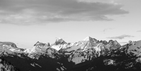 Fototapeta na wymiar Wide black and white photo of snowy mountain range at Mount Baker Snoqualmie National Forest, Washington