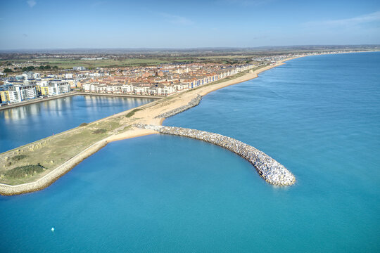 Aerial photo of Sovereign harbour in Eastbourne along the entrance and the start of Pevensey bay.