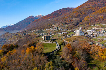 autumnal aerial panorama of Tresivio in Valtellina, Italy