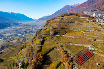 autumnal aerial panorama of Tresivio in Valtellina, Italy