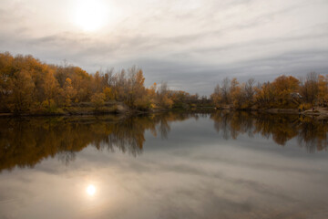 Autumn at pond in evening