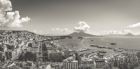 Naples, Italy. August 31, 2021. View of the Gulf of Naples from the Posillipo hill with Mount Vesuvius far in the background. Black and white image.