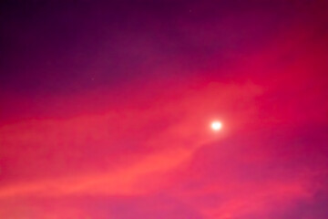 Illustration produced from photographs of evening sky with gradation of light and moon.
