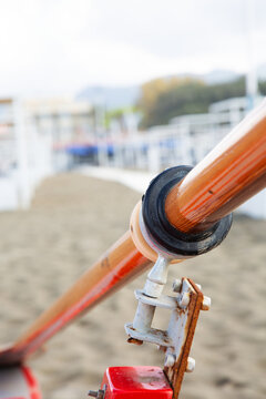 Oar and rowlock near a beach
