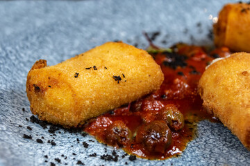 Neapolitan fried panzarotto, filled with mozzarella and tomato.