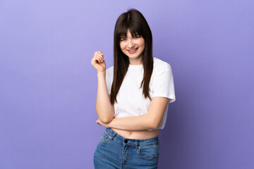 Young Ukrainian woman isolated on purple background laughing