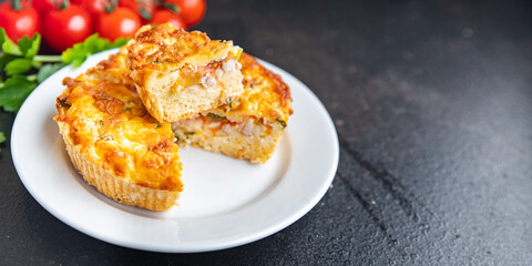 savory pie quiche lauren filling tomato, salmon, vegetables meal snack on the table copy space food background rustic. top view keto or paleo diet veggie vegan or vegetarian food no meat