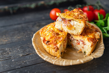 savory pie quiche lauren filling tomato, salmon, vegetables meal snack on the table copy space food background rustic. top view keto or paleo diet veggie vegan or vegetarian food no meat