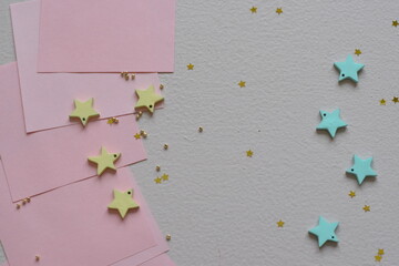 NEW YEAR and Christmas Stars background. Different colours. Christmas decoration. Stars.Top view flatlay . background for children's party. Design of Greeting Card With Christmas stars.