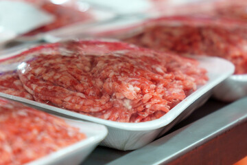 Raw fresh beef meat on the shelves of a hypermarket. Buying raw meat