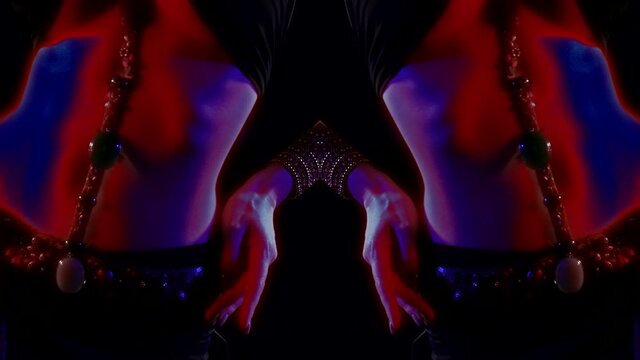 close-up of hands and a female body with a bare belly on a dark background. a woman is dancing. red and blue light. vertical reflection