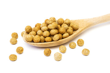 Cereal rye and oats breakfast balls in spoon isolated on white background.