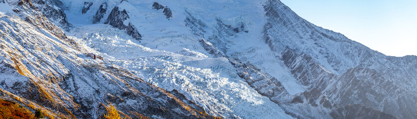Sunset light scattered on ice glacier. Shot taken during hiking through point-to-point trail...