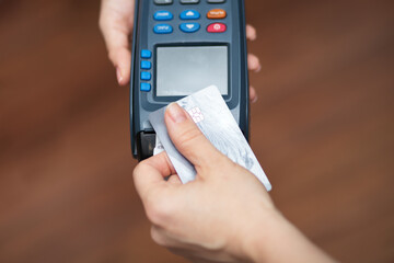 digital payment,hand pays by credit card via contactless terminal
