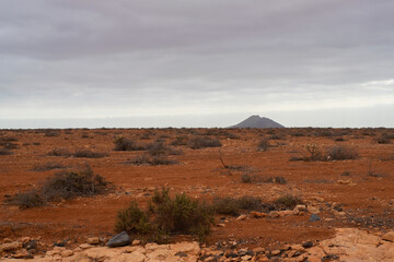 The landscape of dry sandy fields and mountains near Antigua village, Fuerteventura, Canary Islands, Spain.