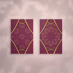 Presentable burgundy business card with luxurious gold ornaments for your brand.