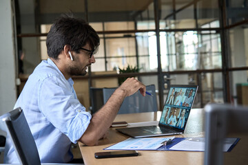 Indian corporate manager leading virtual multicultural business team work meeting workers group...