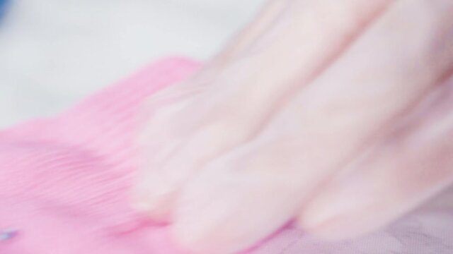 Close up view. Rhinestone gloves with pretty stones into a snowflake pattern.